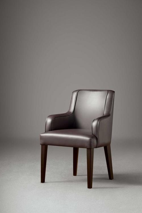 Isabey armchair in Moka Oak finish and covered in leather