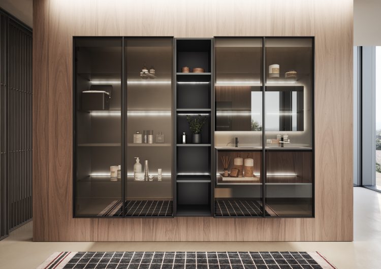 Alu wall-hung tall units with LED lighting behind the shelves. Frame in brushed black aluminium with smoked glass doors