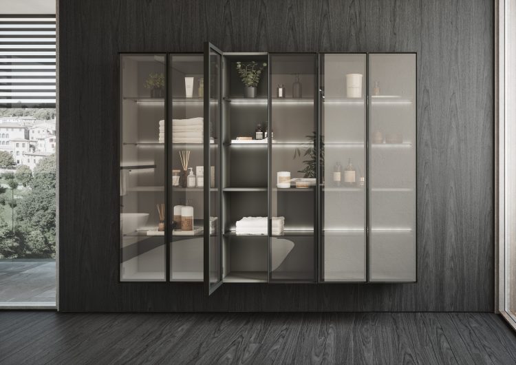 Alu wall-hung tall units with Led lighting behind the shelves. Frame in brushed black aluminium with smoked glass doors 